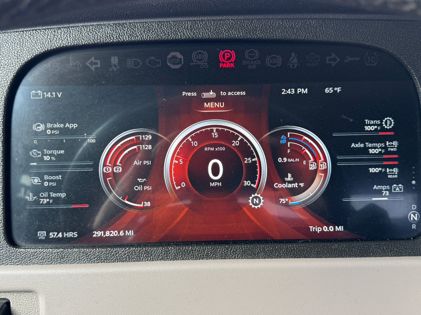 Digital instrument cluster showing vehicle status in red theme. Center dial reads 0 MPH. Surrounding gauges for oil pressure, boost, coolant, and trans temps. Top menu and time 2:43 PM, 65°F. Left shows brake app, torque, oil pressure; rig
