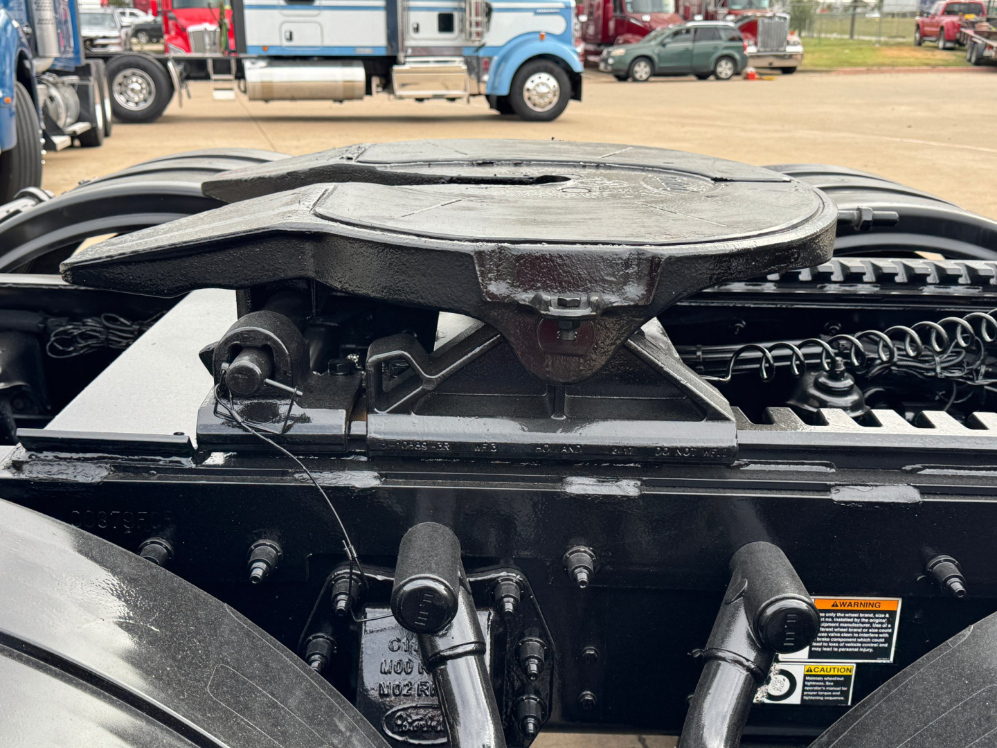 Peterbilt 389 engine bay area showing top fuel cap and surrounding components.