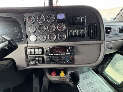 Peterbilt 389 cab interior dashboard showing multiple gauges, switches, and control panel. VIN 1XPXD49X1RD644296, stock 0633576, conventional daycab layout.