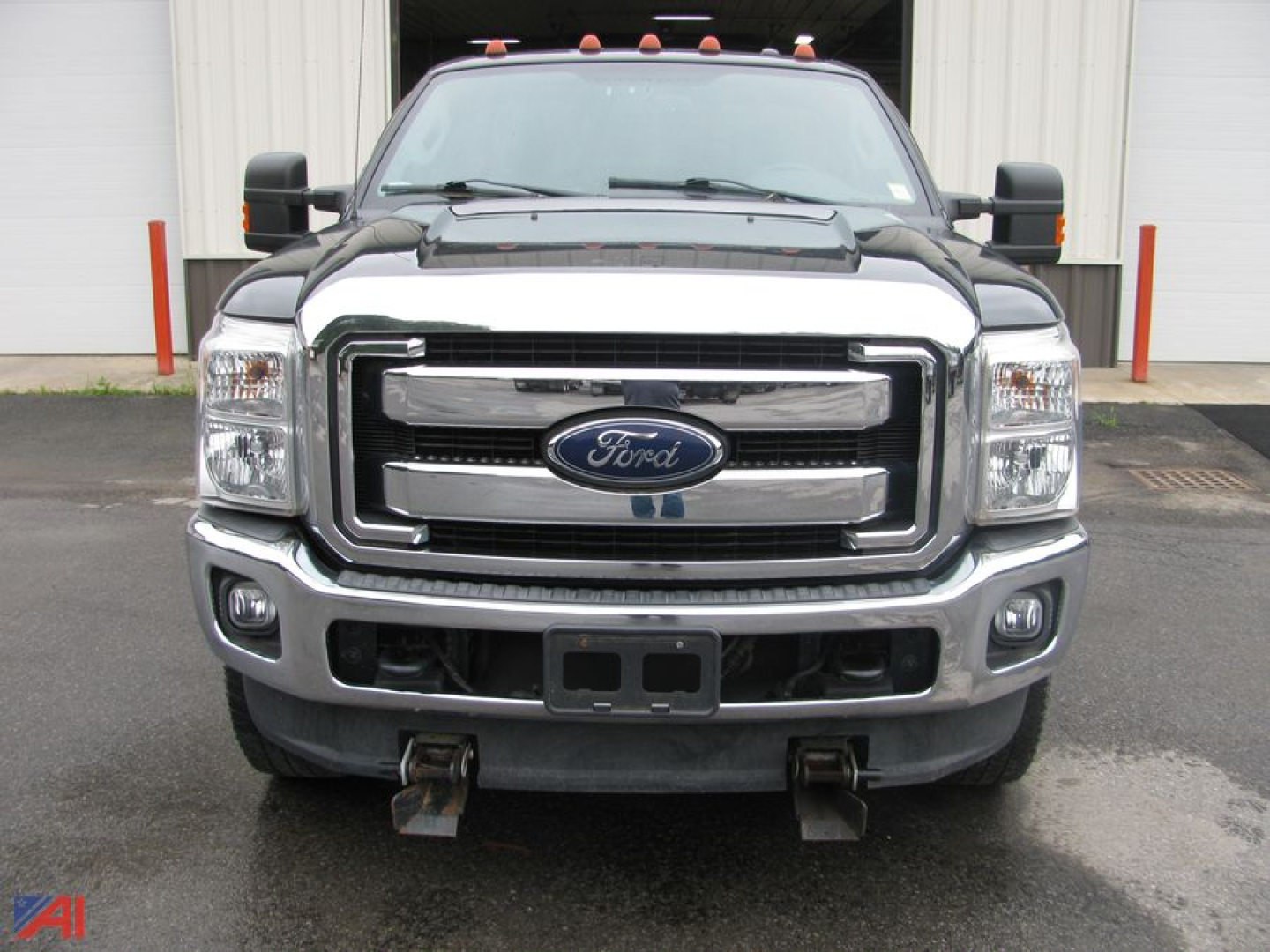 Ford F-250 Super Duty pickup with plow mount showing front view and grille badge
