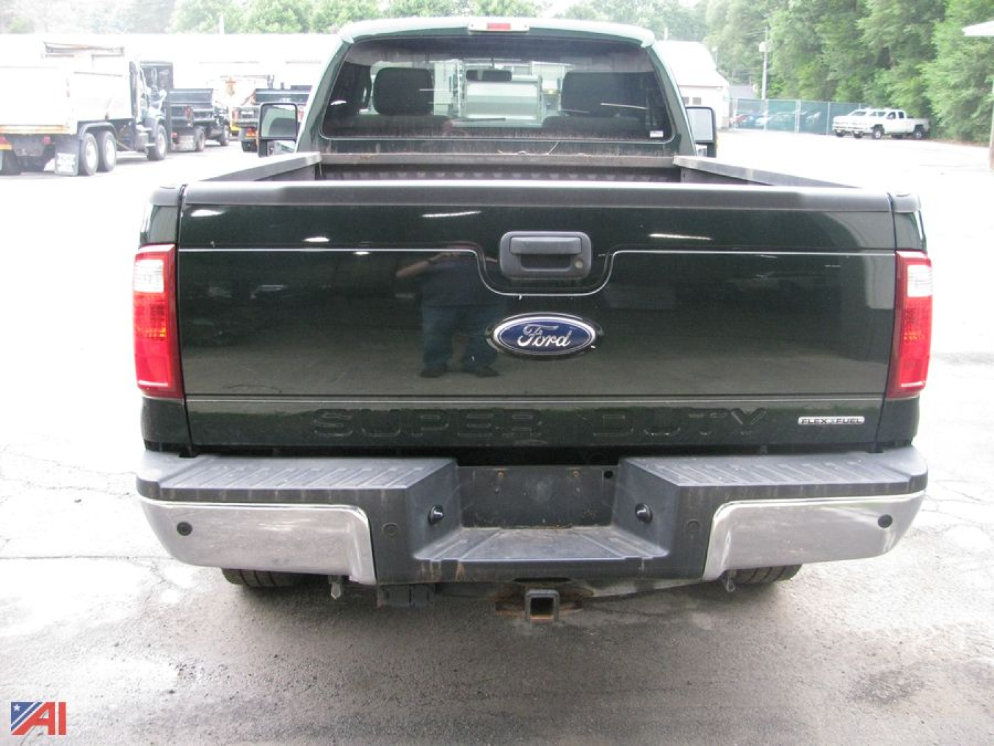 Ford F-250 Super Duty pickup rear view showing tailgate with Ford emblem and plow-compatible rear bumper.