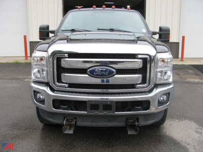 Ford F-250 Super Duty pickup with plow mount showing front view and grille badge
