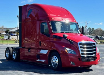 2023 Freightliner Cascadia 126 conventional sleeper truck in red, side view showing cab and front grille.