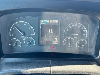 Dashboard of a Freightliner Cascadia 126 showing digital speedometer at 0 mph and analog gauges including rpm, fuel, temperature, and battery. Center display includes speed and gear indicator.