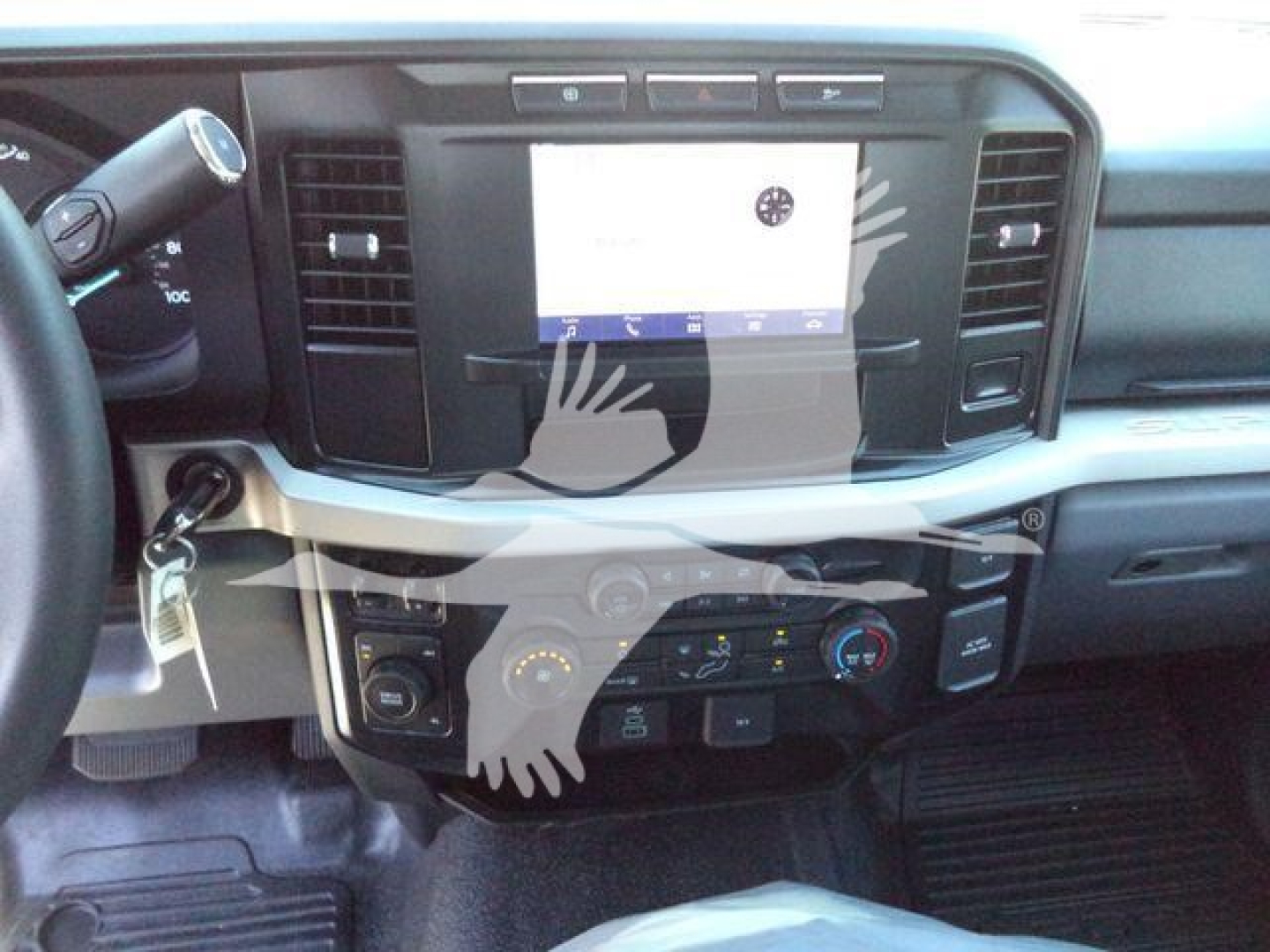 Ford F-600 truck interior showing dashboard with touchscreen display and climate controls.