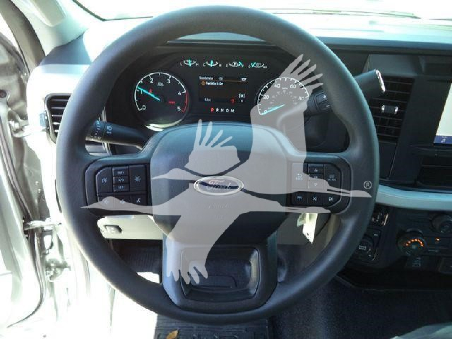 Ford F-600 XLT truck interior dashboard view showing steering wheel and instrument cluster