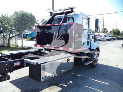MD6 dump truck rear view showing storage box and chassis with hitch for rollback on MD6TUNNELBOX. 