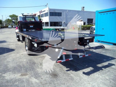 MD6 rollback truck bed on a 2026 Mack MD6 with a flatbed platform and rear lights visible.