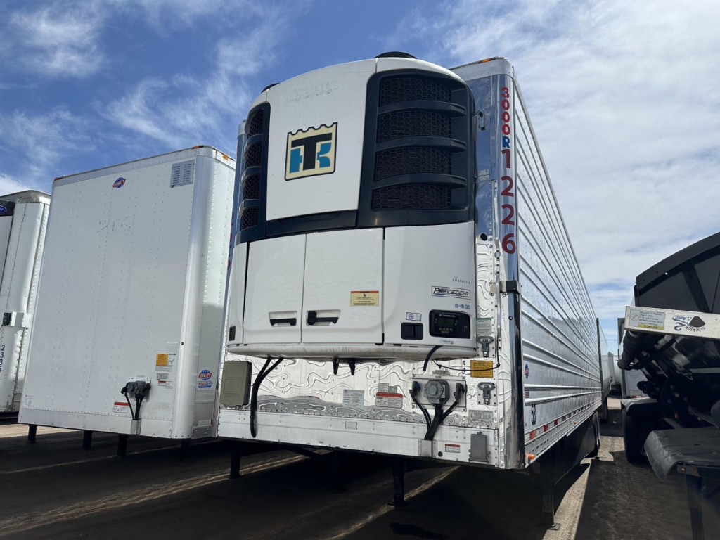 Trailer front view showing Thermo King reefer unit on a 2022 Utility 3000R trailer with DT-style grille and white body.