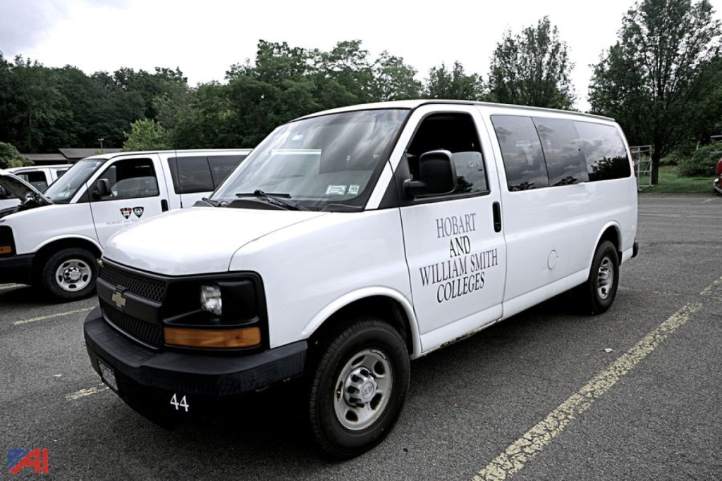 Chevrolet Express 2500 van in a parking lot showing Hobart and William Smith Colleges on the side window and the number 44 on the front bumper.