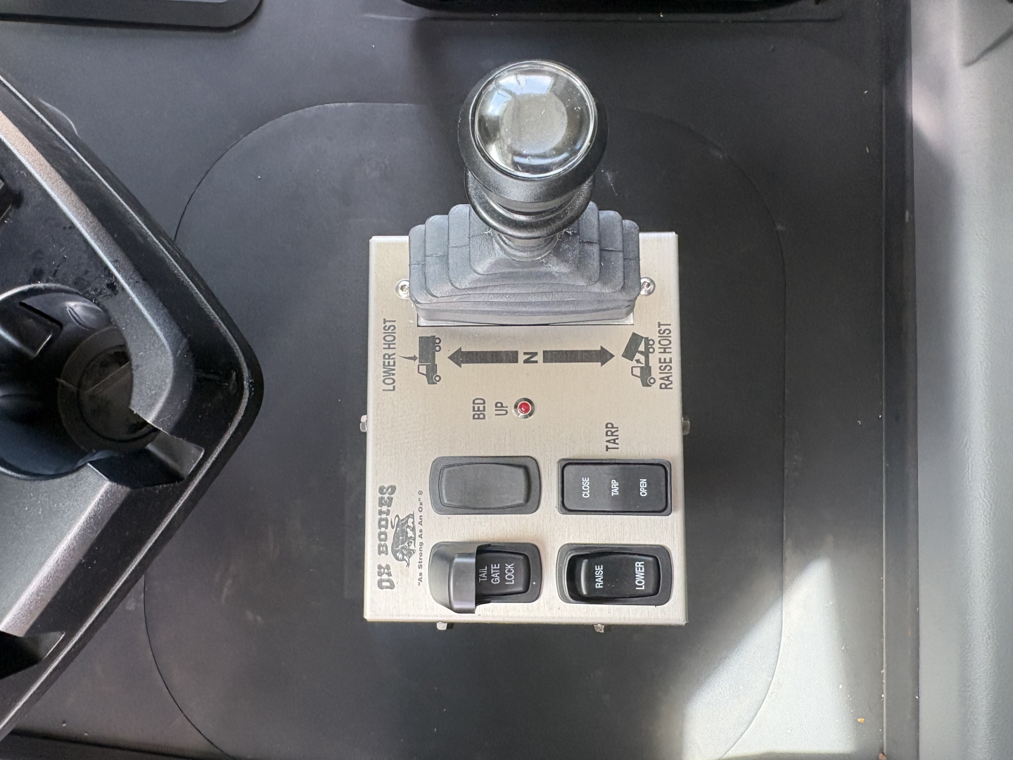 Mack GR84F control lever and switch module showing multiple labeled buttons and levers.