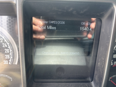 Vehicle dashboard display showing total miles 1540.4 and date Thursday, 04/23/2026 with CHASSIS ID M403 009410.