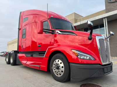 Kenworth T680 sleeper cab tractor truck in red, front-left view, with chrome grille, large mirrors, and dual rear axles.