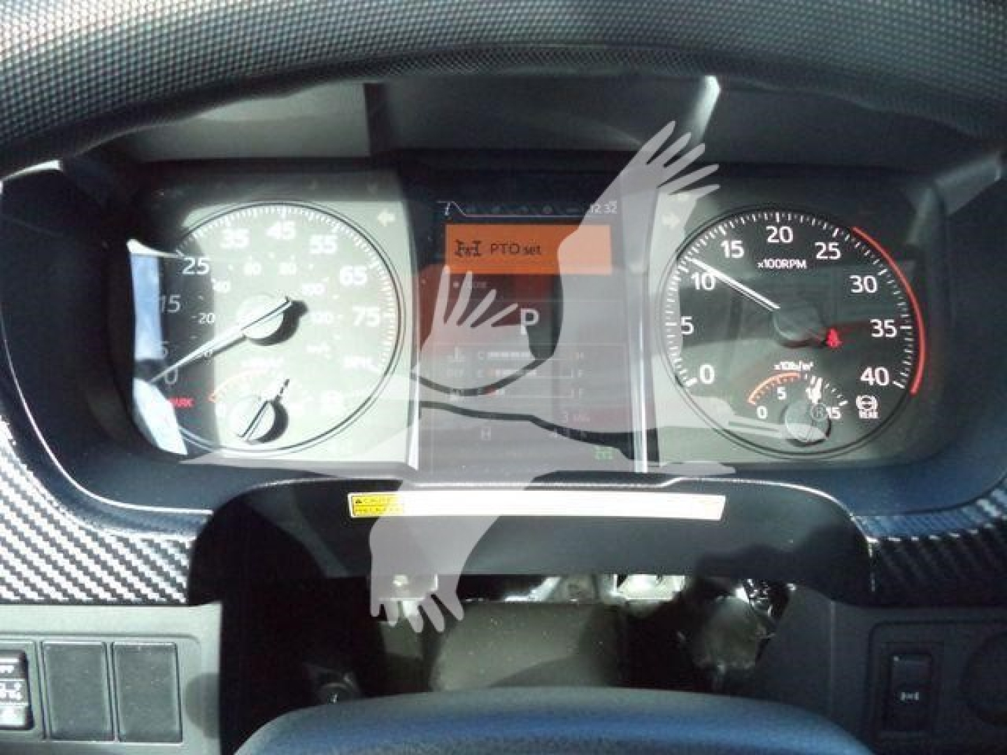 Dashboard view of a 2025 Hino 268A rollback truck showing gauge cluster and center display with odometer and tachometer visible.