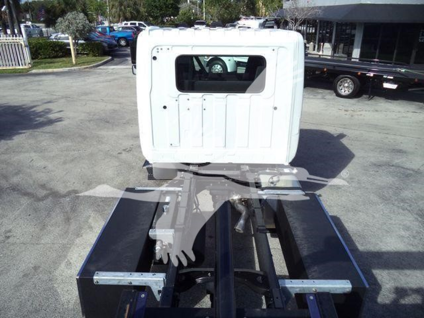 Truck cab rear view with rollback chassis, white cab back and black chassis rails, Hino 268A component placeholders visible.