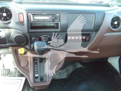 Dashboard and gear selector of a 2025 Hino 268A rollback truck showing steering wheel area, center console, and gear shift with PRND8D feature.