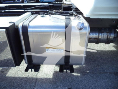Fuel tank on a 2025 Hino 268A truck chassis side view with adjacent piping and frame components visible.