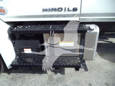 Hino 268A rollback truck side view showing fuel/air intake area, steps, and side storage tank.
