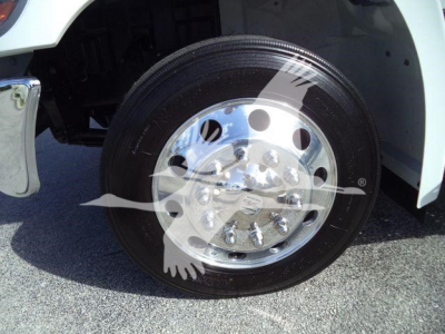 Truck wheel and chrome hub showing polished wheel with lug nuts and tire on a Hino 268A rollback truck