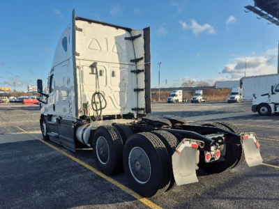 Truck chassis and cab of a Freightliner Cascadia126 tractor showing rear wheels and sleeper cab