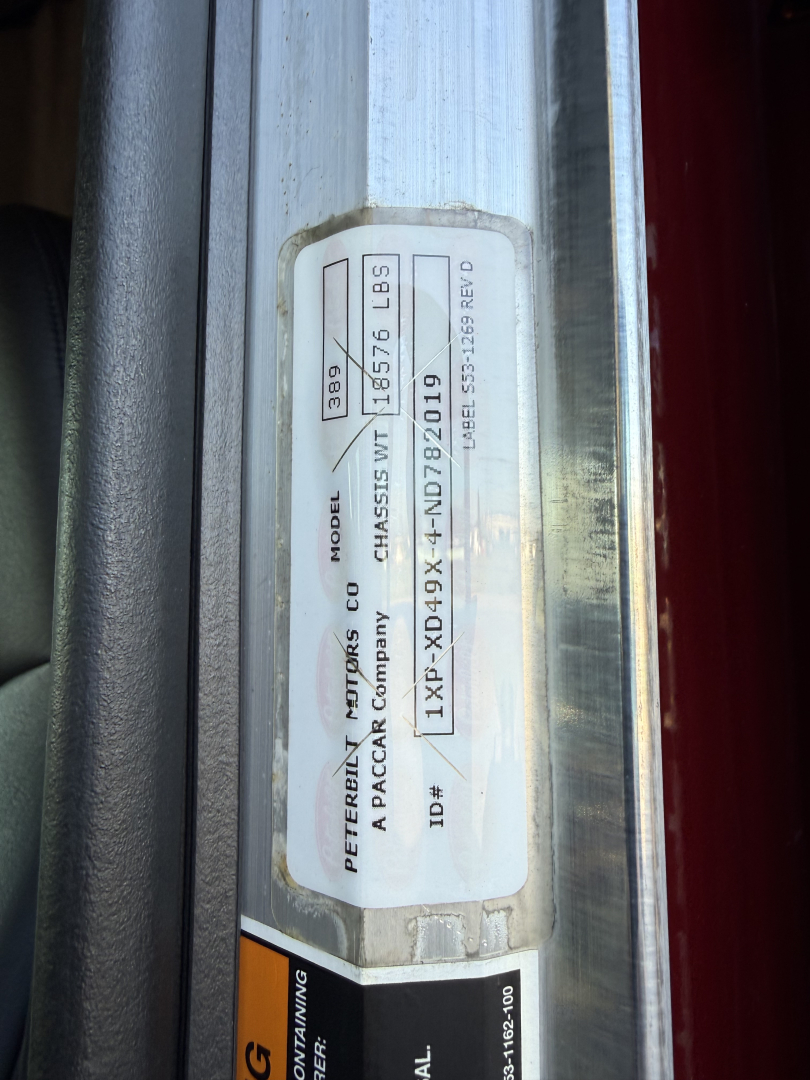 Peterbilt tag showing model 389, chassis WT 185765 lbs, GVWR IB? - VIN 1XPXD49X4ND782019, ID 1XP-XD49XND782019, tag in door jamb