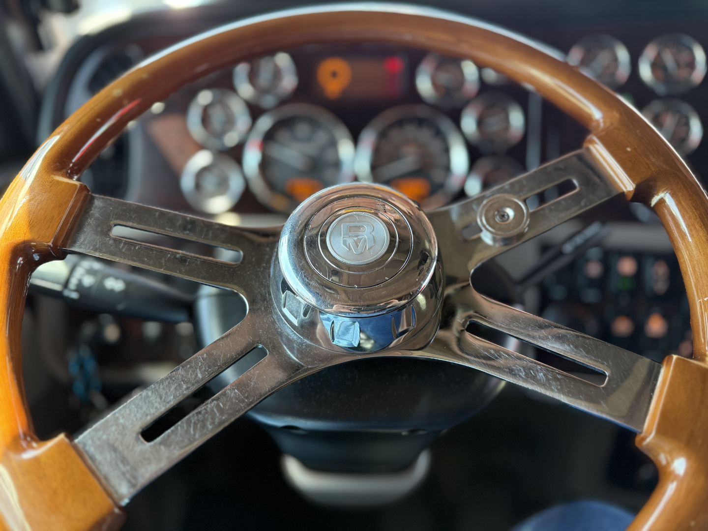 Peterbilt 389 steering wheel and dashboard view with gauges in background