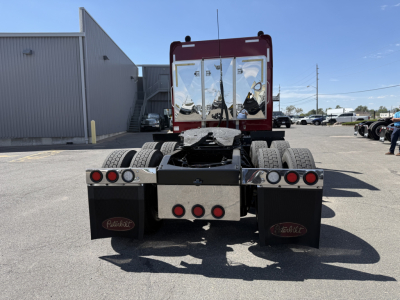 Peterbilt 389 rear view showing chassis, dual rear axles, rear bumper with Mudflaps, and fifth wheel removed; clear visibility of cab back and taillights.