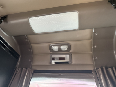 Peterbilt 389 sleeper cab interior roof panel with overhead light, small window cover, and rectangular vents