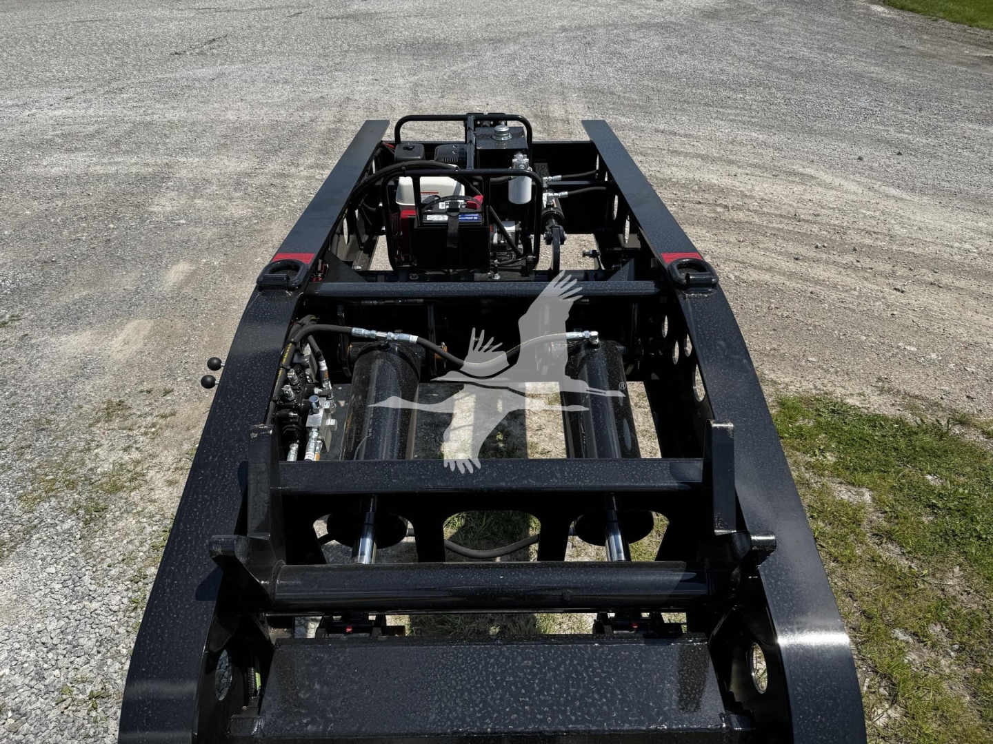 Fontaine XN20 lowboy trailer frame showing chassis and mounting components with engine-like visible parts and hydraulic lines.