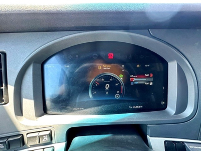 Kenworth T680 dashboard display showing speedometer and warning icons in the instrument cluster.