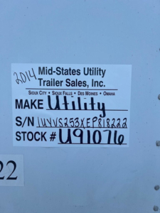 Sticker on trailer showing 2014 Mid-States Utility Trailer Sales, Inc. MAKE Utility, S/N UYVS253XEP818222, STOCK # U91076, Sioux City Sioux Falls Des Moines Omaha