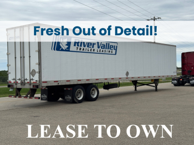 Utility trailer 2014 4000D-X with River Valley Trailer Leasing logo on side, tandem rear axles, stock visible, fresh detail banner across image.