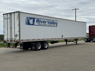 Trailer side view showing River Valley Trailer Leasing logo on a white cargo trailer.