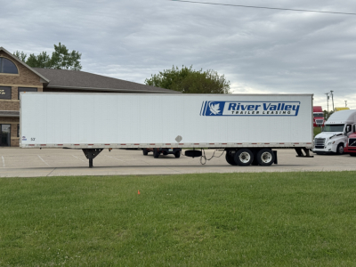 Trailer side view showing River Valley Trailer Leasing logo on a long white utility trailer.
