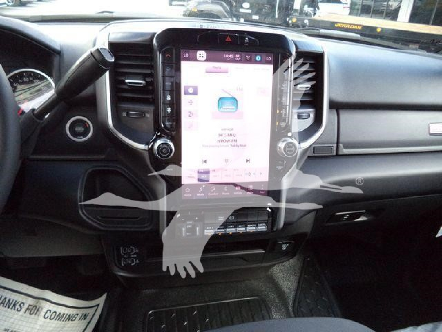 Ram 4500 Big Horn truck interior showing large central touchscreen display and dashboard controls.