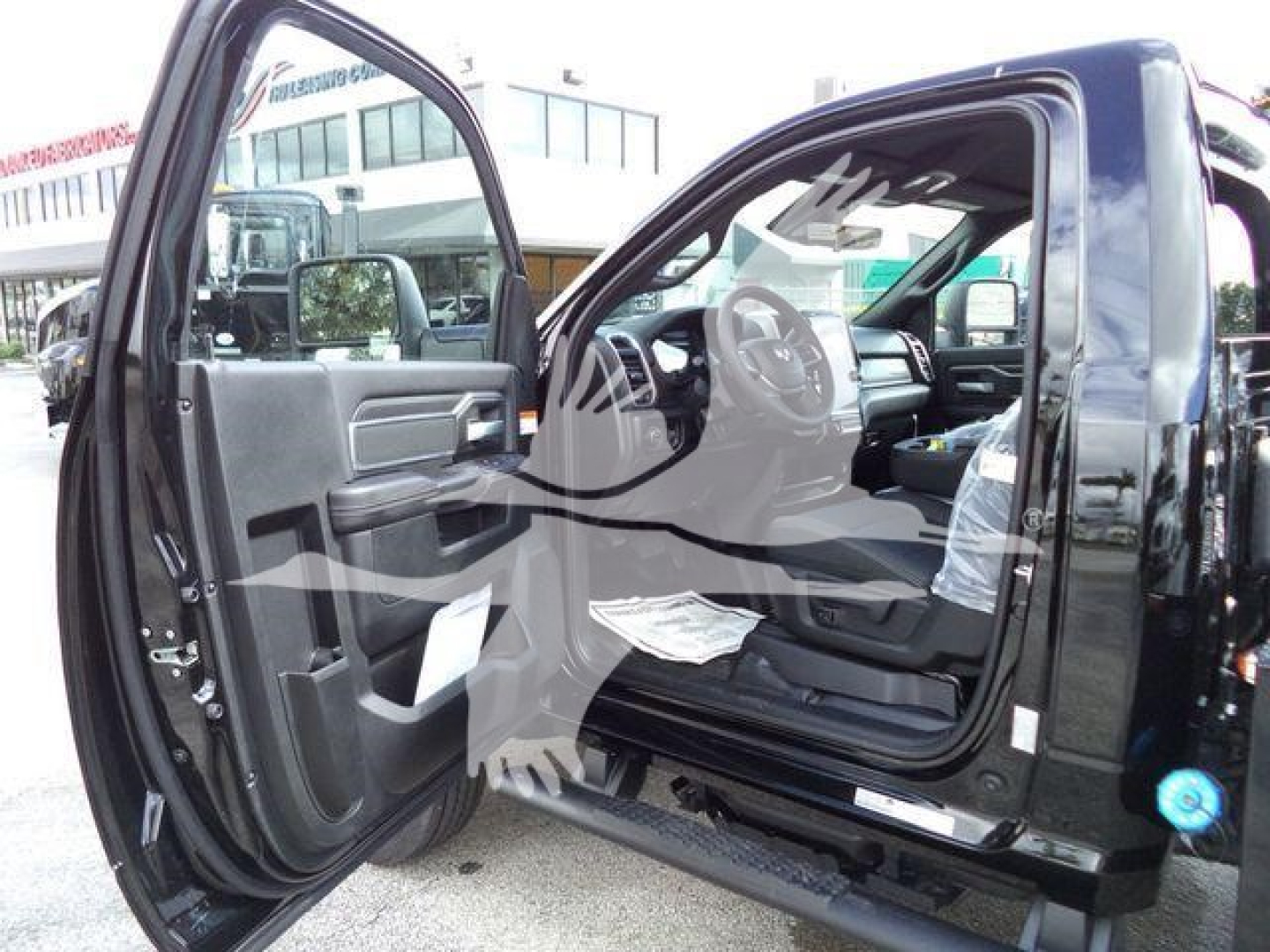 Ram 4500 Big Horn interior view with front passenger door open showing steering wheel and dashboard.