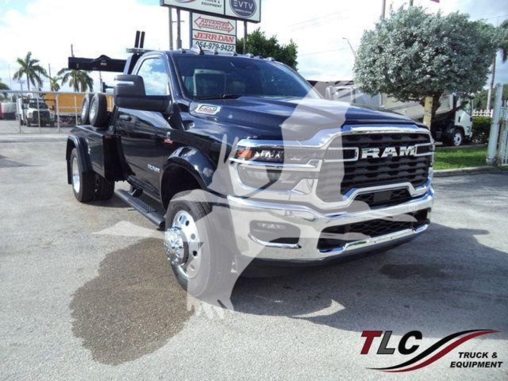Ram 4500 Big Horn truck front left view showing heavy-duty grille and dual rear wheels with winch equipment in bed.