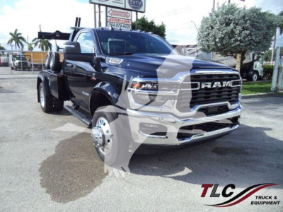 Ram 4500 Big Horn truck front left view showing heavy-duty grille and dual rear wheels with winch equipment in bed.