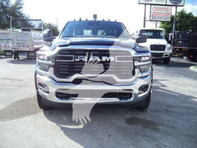 Ram 4500 truck front view showing bold grille and headlights, with dealership lot in background.