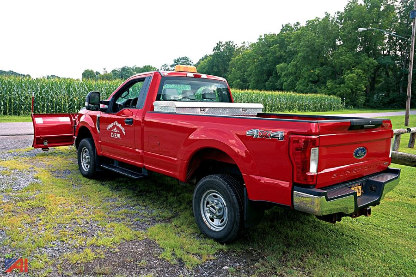 Ford F-350 Super Duty pickup 4x4 with red body and bed cap showing 4X4 badge and chrome bumper.