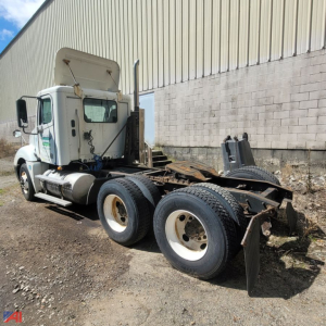 Freightliner Columbia 120 chassis with cab and rear wheel setup visible; tag shows parts-only truck with missing sleeper; white cab, dual rear axles, exposed frame rails.