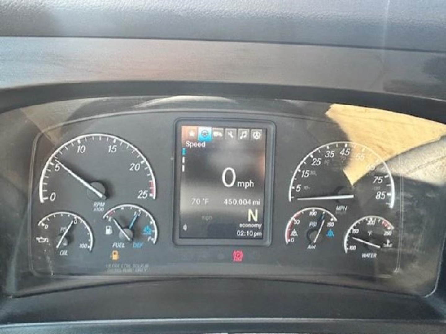 Dashboard of a 2022 Freightliner Cascadia 126 showing instrument cluster with speedometer, tachometer, and digital display reading 0 mph, 70°F, 450,004 mi, N gear.