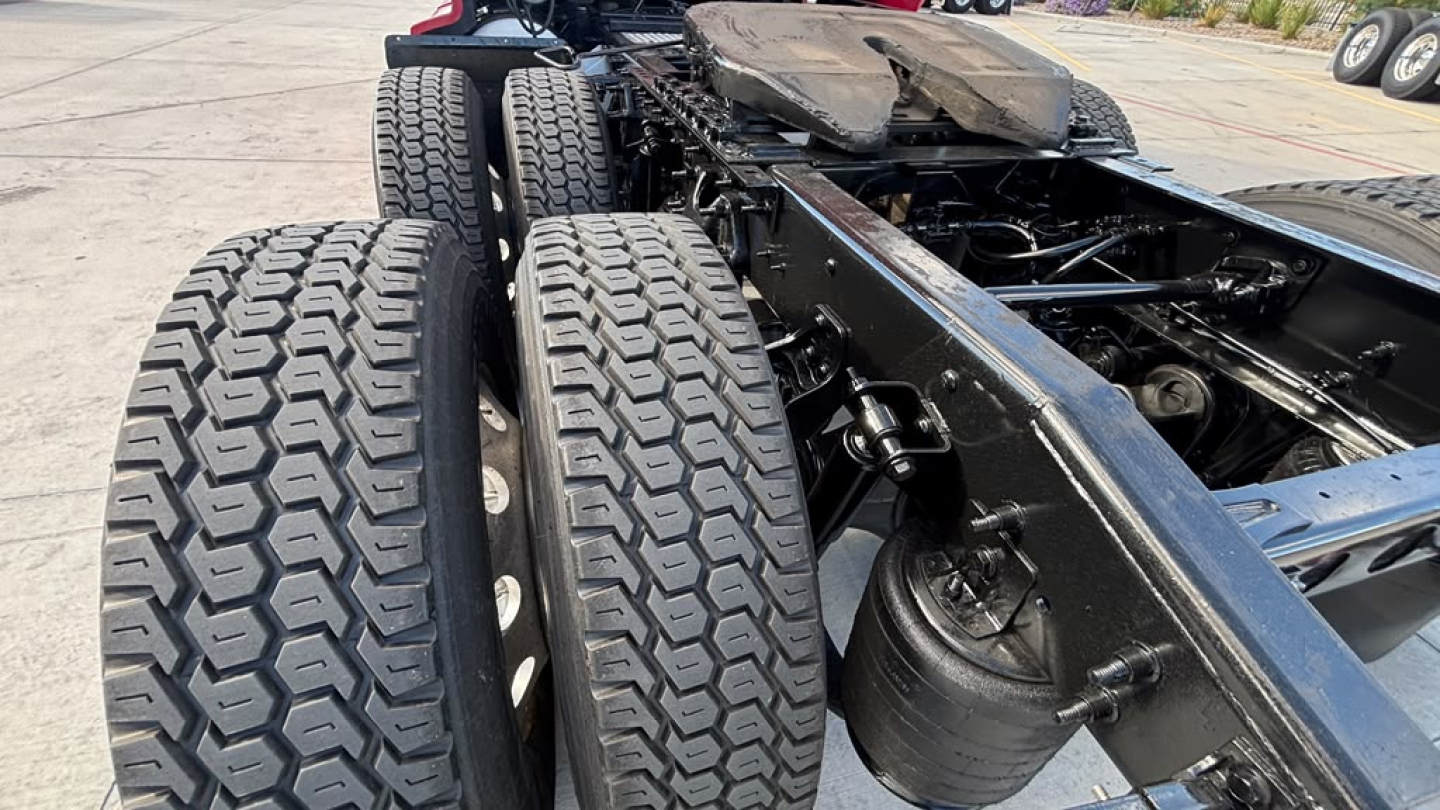 International LT625 chassis showing dual rear axles with heavy-duty tires and frame rails.