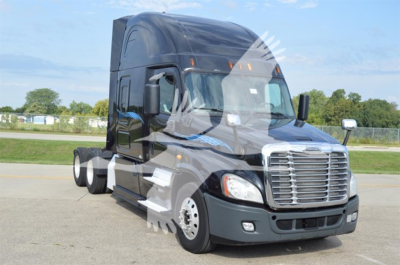 Truck cab view: 2014 Freightliner Cascadia 125 Evolution conventional sleeper, front-left angle showing chrome grille, headlights, and black paint.