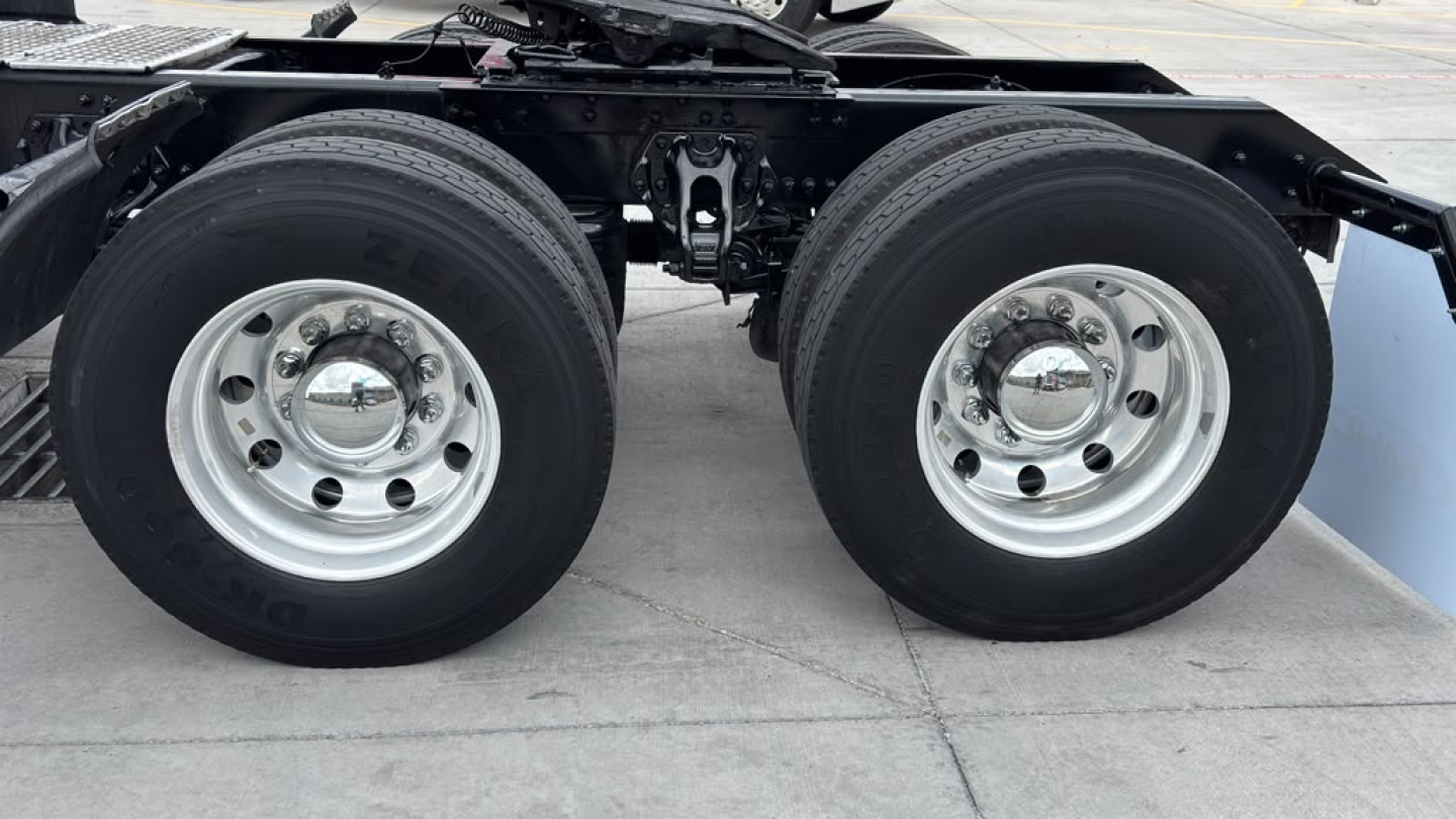 Kenworth T680 rear axles and suspension showing dual rear wheels and axle housing.