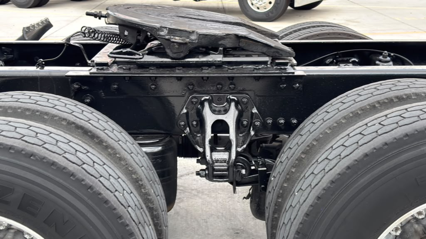 Kenworth truck rear chassis showing drive axle suspension and fifth wheel, no text visible on components.