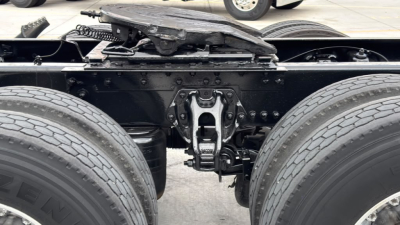 Kenworth truck rear chassis showing drive axle suspension and fifth wheel, no text visible on components.
