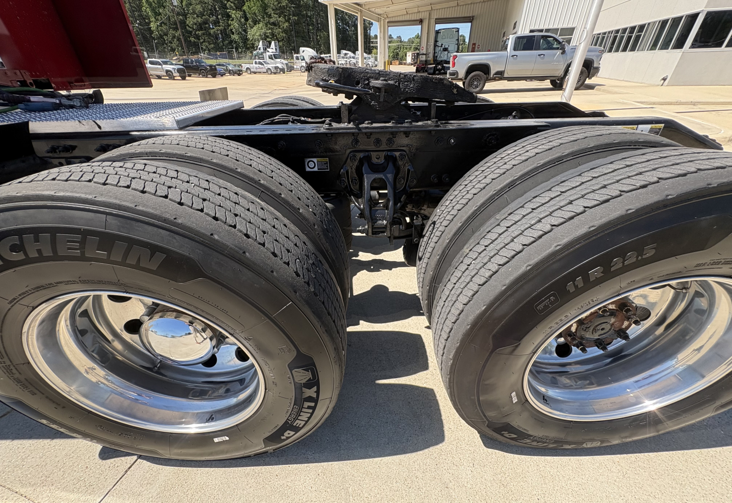 Peterbilt 579 heavy-duty truck rear wheels and chassis showing dual rear tires and suspension components.