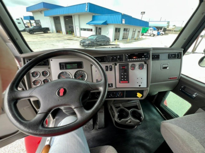Kenworth T270 truck interior showing steering wheel, dashboard gauges, and center control panel.