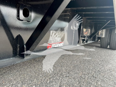 Manac steel drop extendable trailer underside with logo and support beams visible
